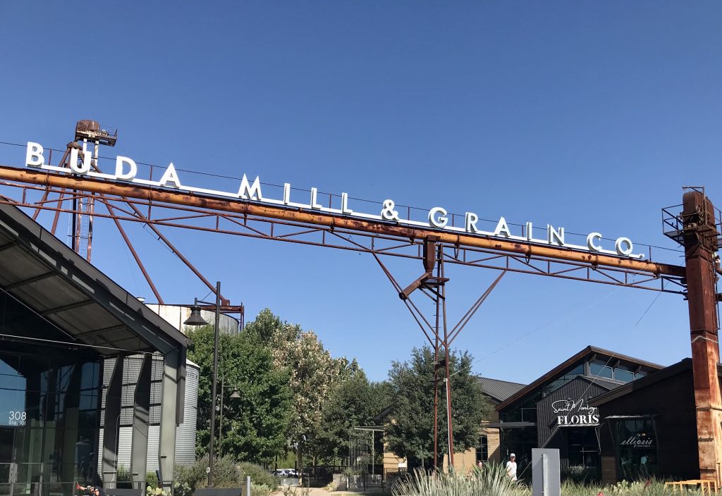 Buda Mill and Grain Co. sign above local shops