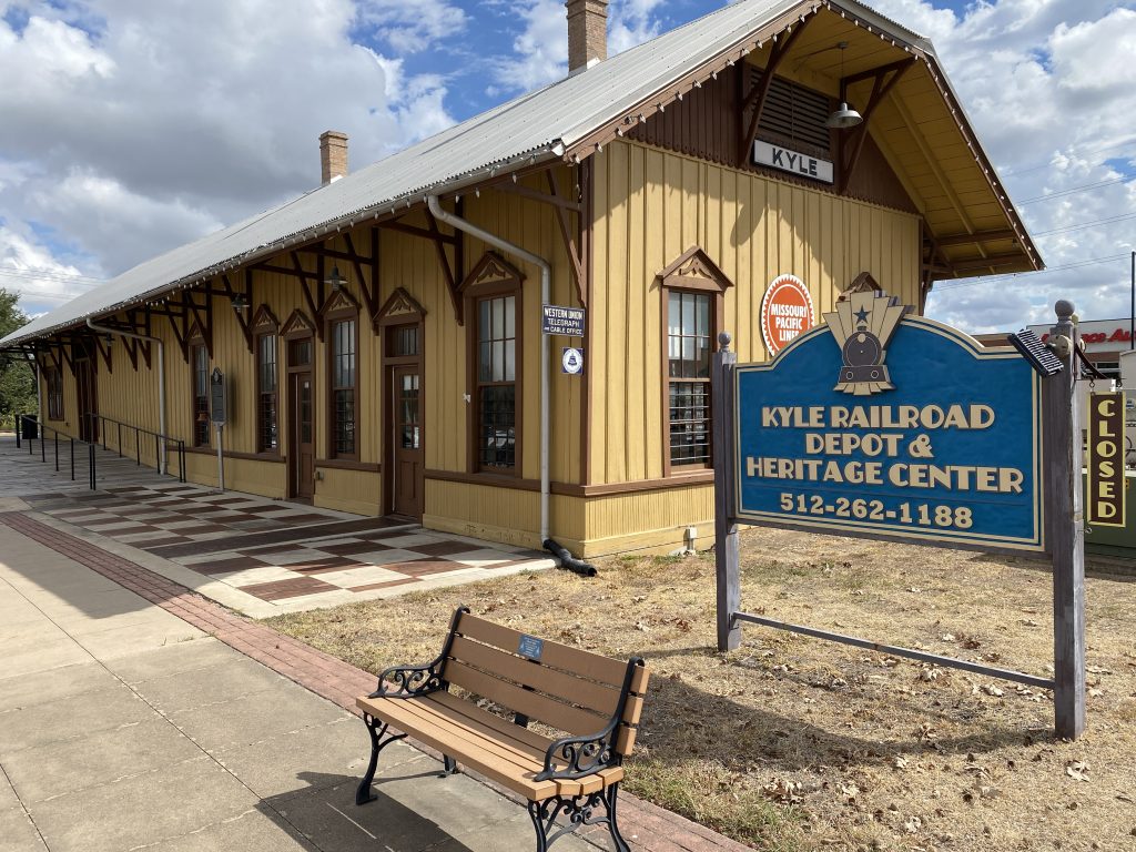 The historic yellow Kyle Railroad Depot